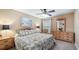 Spacious bedroom with a king-size bed and plenty of storage at 26715 Manassas Dr, Leesburg, FL 34748