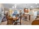 Dining area with wood table and chairs, located near kitchen and living room at 26715 Manassas Dr, Leesburg, FL 34748