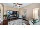 Gathering-friendly living room with ample seating and large TV at 26715 Manassas Dr, Leesburg, FL 34748