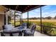 Relaxing screened porch with fire pit and golf course views at 26715 Manassas Dr, Leesburg, FL 34748