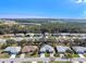 Aerial view of a residential neighborhood with houses and roads at 26912 Tanner St, Leesburg, FL 34748