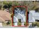 An aerial view of a single Gathering home with a grey roof at 26912 Tanner St, Leesburg, FL 34748