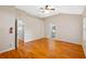 Primary bedroom with hardwood floors and access to bathroom at 26912 Tanner St, Leesburg, FL 34748