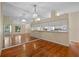 Open dining area with hardwood floors and kitchen views at 26912 Tanner St, Leesburg, FL 34748