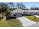 Two-unit property featuring identical houses with garages and neatly kept lawns at 26912 Tanner St, Leesburg, FL 34748