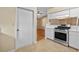 View of kitchen with stainless steel range and white cabinets at 26912 Tanner St, Leesburg, FL 34748