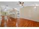 Spacious living room featuring hardwood floors and a ceiling fan at 26912 Tanner St, Leesburg, FL 34748