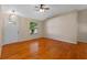 Living room with hardwood floors and a view of the front door at 26912 Tanner St, Leesburg, FL 34748