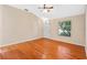 Hardwood floor living room with a view of the front door and window at 26912 Tanner St, Leesburg, FL 34748