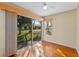 Bright sunroom with wood floors and sliding glass doors at 26912 Tanner St, Leesburg, FL 34748