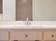 Bathroom boasts a spacious vanity with a large mirror and modern faucet, perfect for everyday convenience at 26913 Racquet Cir, Leesburg, FL 34748