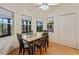 Bright dining area with built in seating and view at 26913 Racquet Cir, Leesburg, FL 34748