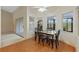 Dining area with table and chairs, overlooking backyard at 26913 Racquet Cir, Leesburg, FL 34748