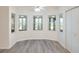 Bright dining area with windows and a ceiling fan at 26913 Racquet Cir, Leesburg, FL 34748