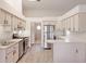 Well-equipped kitchen featuring stainless steel appliances, and modern countertops at 26913 Racquet Cir, Leesburg, FL 34748