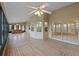 Spacious screened porch with brick tile flooring and hot tub at 26913 Racquet Cir, Leesburg, FL 34748