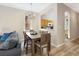 Dining area with a table for six, adjacent to the kitchen at 2713 Impala Ln, Kissimmee, FL 34746