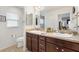 Double vanity bathroom with updated fixtures and a toilet at 2954 Silk Tree Ter, The Villages, FL 32163