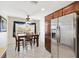 Bright dining area with a table and chairs near a window at 2954 Silk Tree Ter, The Villages, FL 32163