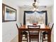 Charming dining area with a wooden table and four chairs at 2954 Silk Tree Ter, The Villages, FL 32163