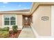 Front entry with decorative door and walkway at 2954 Silk Tree Ter, The Villages, FL 32163