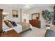 Comfortable main bedroom with a king-size bed and dresser at 2954 Silk Tree Ter, The Villages, FL 32163