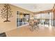 Relaxing screened porch with tile floor and outdoor furniture at 2954 Silk Tree Ter, The Villages, FL 32163