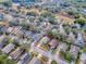 House's aerial view, showing its location in a residential neighborhood at 30111 Pga Dr, Mount Plymouth, FL 32776