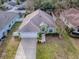 Nice green house with a two-car garage and well-manicured lawn at 30111 Pga Dr, Mount Plymouth, FL 32776