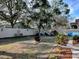 Spacious backyard with firepit and playset at 30111 Pga Dr, Mount Plymouth, FL 32776