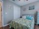 Guest bedroom with a tropical comforter and built-in closet at 30111 Pga Dr, Mount Plymouth, FL 32776