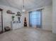 Dining room with tile floors, window with blinds and chandelier at 30111 Pga Dr, Mount Plymouth, FL 32776