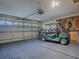 Spacious garage with golf cart and ample storage at 30111 Pga Dr, Mount Plymouth, FL 32776