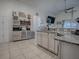 Kitchen boasts granite countertops, stainless steel appliances, and ample cabinet space at 30111 Pga Dr, Mount Plymouth, FL 32776