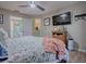 Main bedroom with king-size bed, dresser and view of bathroom at 30111 Pga Dr, Mount Plymouth, FL 32776