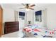 Bedroom with a vintage dresser and nautical bedding at 32125 Mark Ave, Tavares, FL 32778