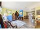 Bright living room features hardwood floors and a view into the dining area at 32125 Mark Ave, Tavares, FL 32778