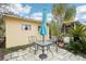 Small patio with table, chairs, and umbrella at 32125 Mark Ave, Tavares, FL 32778