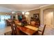 Open concept dining room with views into the living room and kitchen at 3257 Triton Ct, The Villages, FL 32163