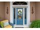 Inviting front entrance with a blue door and sidelights at 3257 Triton Ct, The Villages, FL 32163