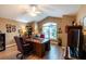 Spacious home office features built-in shelving and large desk at 3257 Triton Ct, The Villages, FL 32163