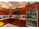 Kitchen boasts granite countertops and stainless steel appliances at 3257 Triton Ct, The Villages, FL 32163