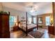 Large main bedroom with post bed and plenty of natural light at 3257 Triton Ct, The Villages, FL 32163