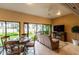 Bright sunroom with seating area and view of backyard at 3257 Triton Ct, The Villages, FL 32163