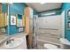 Teal bathroom with tub shower combination at 3310 Manatee Rd, Tavares, FL 32778