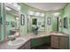 Bathroom with double vanity and light green walls at 3310 Manatee Rd, Tavares, FL 32778