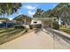 Single-story home with carport and landscaped yard at 3310 Manatee Rd, Tavares, FL 32778