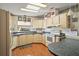 Cozy kitchen featuring wood cabinets and ample counter space at 3310 Manatee Rd, Tavares, FL 32778