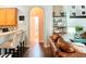 Kitchen with breakfast bar, view of living room and bathroom at 335 Grand Reserve Dr, Davenport, FL 33837