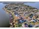 Aerial view showing a single Gathering home on waterfront lot at 33648 Picciola Dr, Fruitland Park, FL 34731